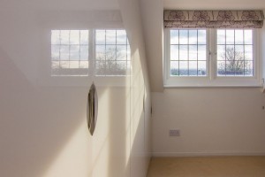 Home interior photography - sleek gloss finishing on wardrobe doors