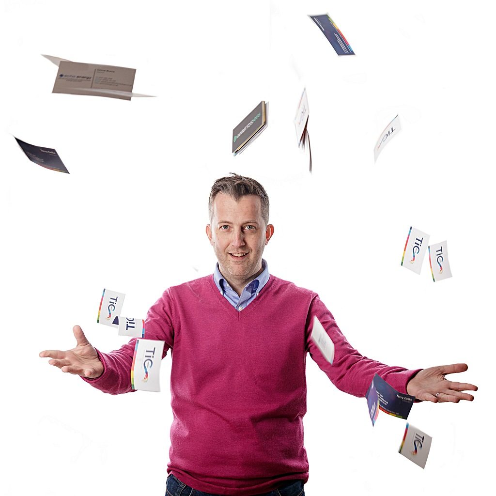 Portrait of Terry Cella, printer surrounded by 'flying' business cards. Created by Pete Bresser, photographer