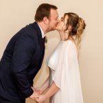Bride and groom kissing for first time and man and wife