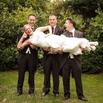 Bride Stacey gets a lift from the groomsmen