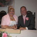 Married couple signing the register
