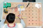 worker at a workbench on site with tools